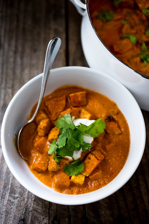 This fall-inspired recipe for Roasted Butternut Tikka Masala can be made with chickpeas or chicken. The fragrant tomato coconut sauce is infused with Indian spices. Vegan & Gluten Free! A healthy delicious dinner recipe, perfect for fall!  #tikkamasala #butternuttikkamasala #butternutmasala #vegandinner #vegetariandinner #falldinner