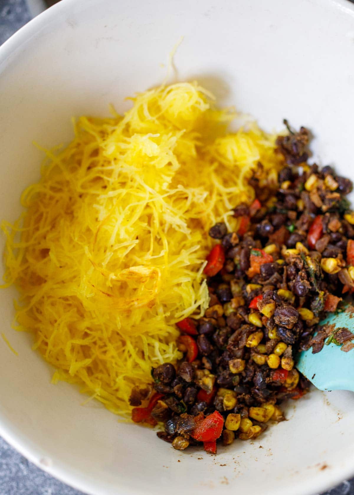 cooked spaghetti squash and black bean mixture in a bowl. 