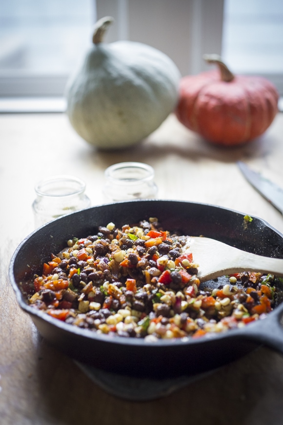 Enchilada Stuffed Spaghetti Squash with black beans, cilantro, corn and bell pepper --keep it vegan or add cheese | www.feastingathome.com
