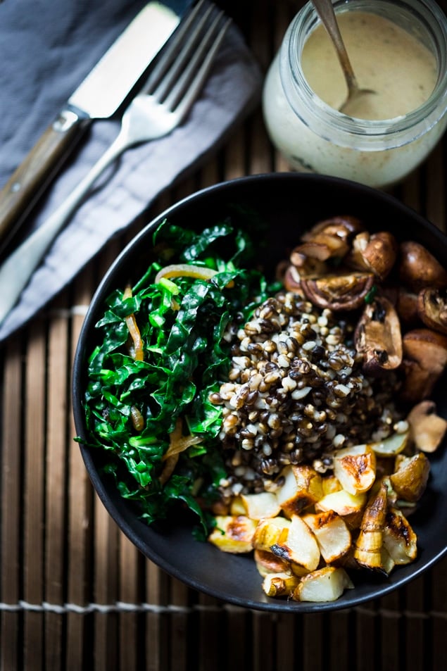 vegan buddha bowl This Roasted Sunchoke and Black Nile Barley Bowl, with kale, mushrooms and parsnips & a Zaatar spiced Tahini Sauce is perfect for fall! Vegan and Nutritious! | www.feastingathome.com