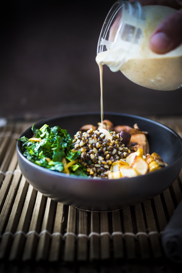 This Roasted Sunchoke and Black Nile Barley Bowl, with kale, mushrooms and parsnips & a Zaatar spiced Tahini Sauce is perfect for fall! Vegan and Nutritious!