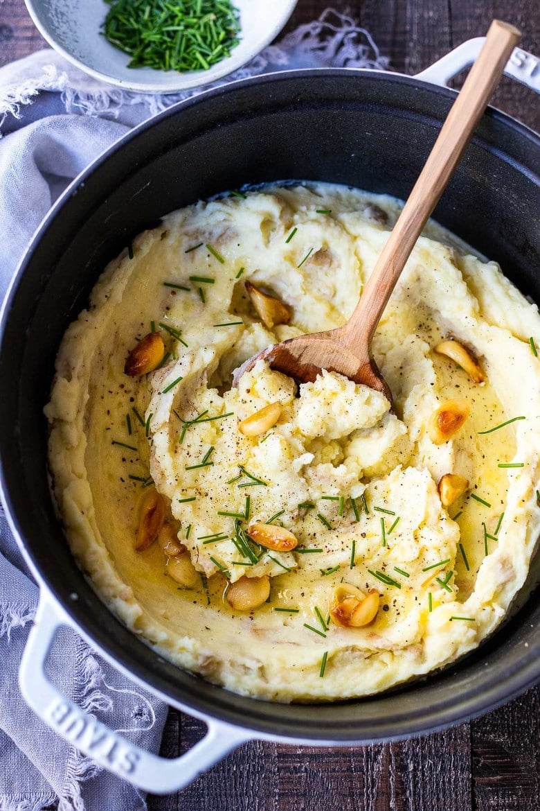 These Garlic Mashed Potatoes are simply heavenly! Creamy, richly flavorful and easy to make, they are the ultimate side dish to any meal! Easy enough for weeknight dinners, elegant enough for the holiday table. Vegan-adaptable and GF.