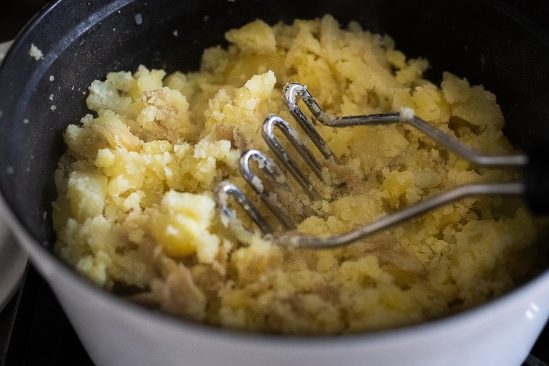 mashed the potatoes with a potato masher