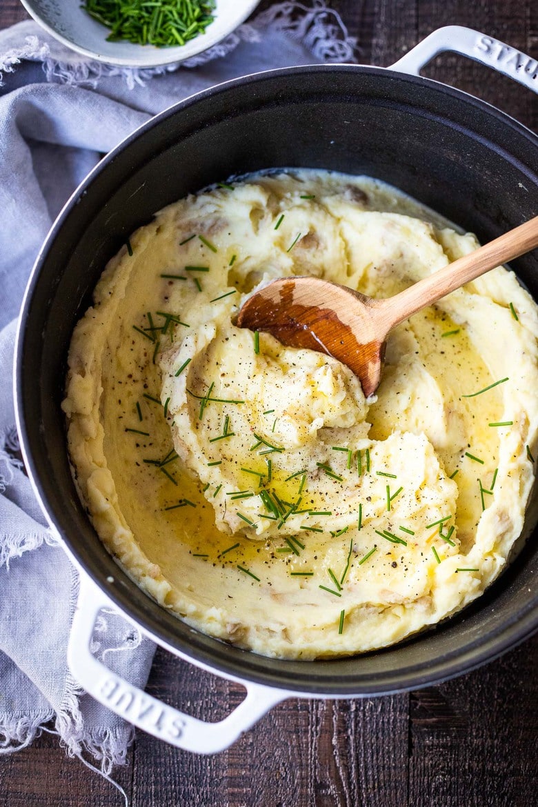 These Garlic Mashed Potatoes are simply heavenly! Creamy, richly flavorful and easy to make, they are the ultimate side dish to any meal! Easy enough for weeknight dinners, elegant enough for the holiday table. Vegan-adaptable and GF.