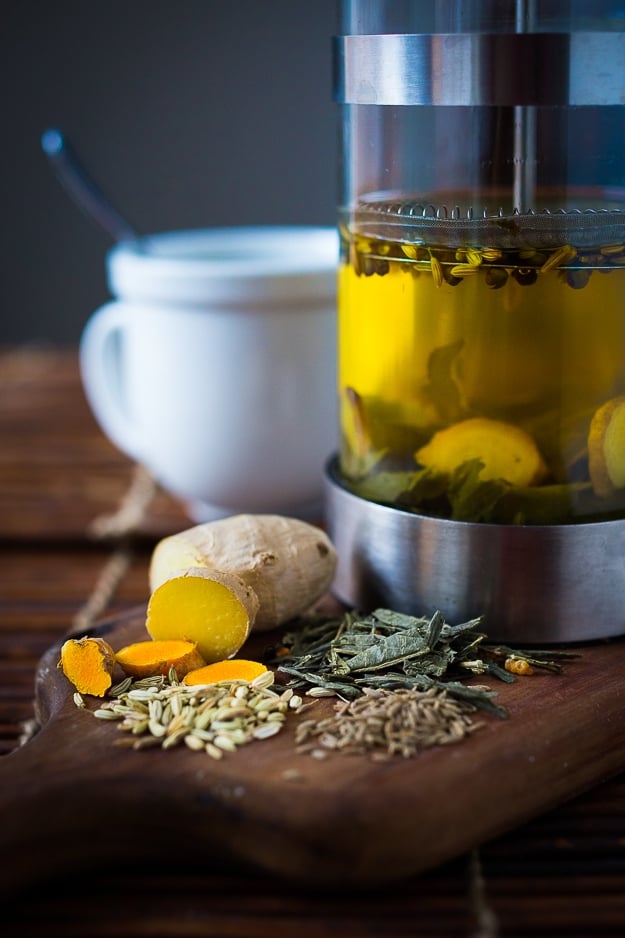 Ayurvedic Turmeric Detox Tea...a special blend of turmeric, ginger and whole spices...to help detox the body! Plus The incredible healing power of TURMERIC ROOT ! Learn all the ways it helps our bodies + Plus 10 delicious turmeric Recipes to harness its super power! #turmeric #turmericrecipes #turmericroot 