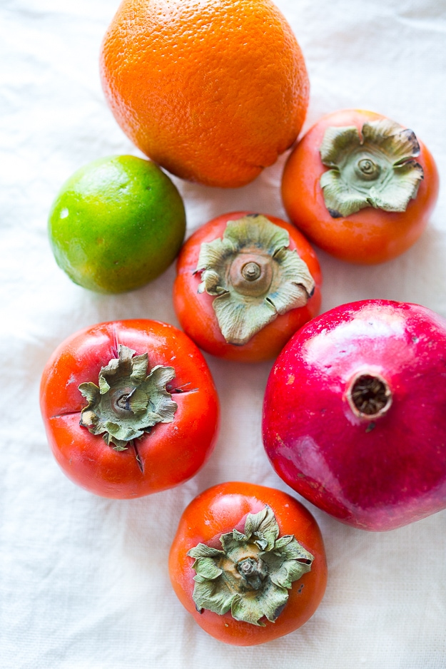 Persimmon, pomegranate and shaved fennel salad with honey citrus dressing. vegan, gf | www.feastingathome.com Butter Lettuce Salad with persimmons, shaved fennel, pomegranate seeds, and a bright citrus dressing. Perfect for the holiday Table! Vegan and Gluten-free | #persimmon #feastingathome #butterlettucesalad #vegansalad #salad #holidaysalad #persimmonsalad #persimmonrecipe #christmasrecipes