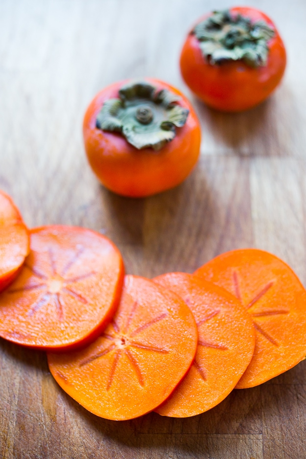 Persimmon, pomegranate and shaved fennel salad with honey citrus dressing. vegan, gf | www.feastingathome.com Butter Lettuce Salad with persimmons, shaved fennel, pomegranate seeds, and a bright citrus dressing. Perfect for the holiday Table! Vegan and Gluten-free | #persimmon #feastingathome #butterlettucesalad #vegansalad #salad #holidaysalad #persimmonsalad #persimmonrecipe #christmasrecipes