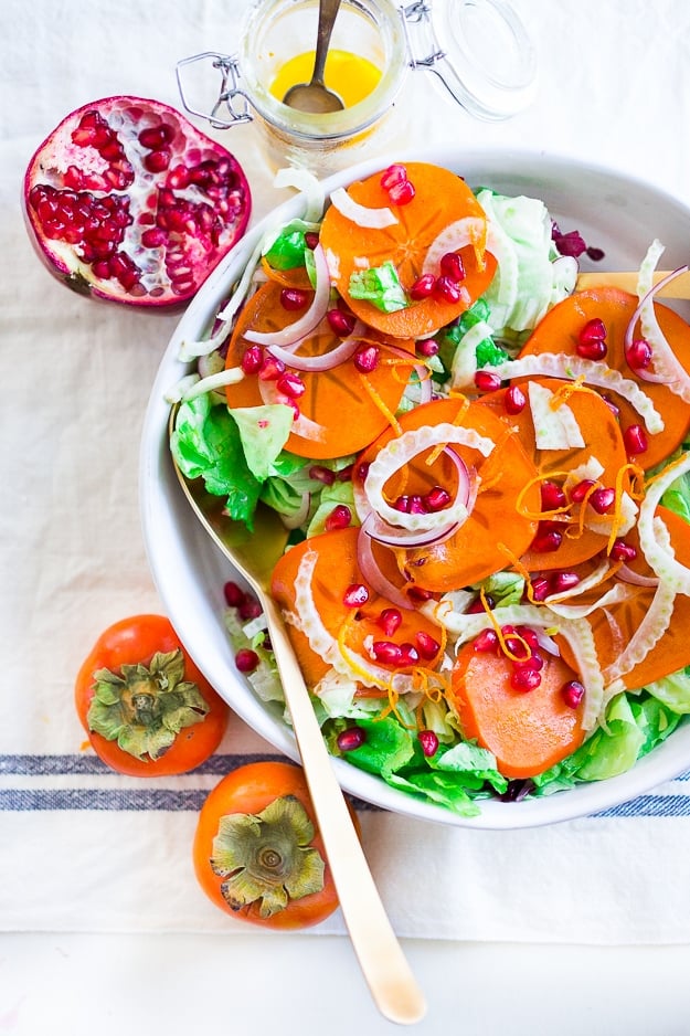 Persimmon, pomegranate and shaved fennel salad with honey citrus dressing. vegan, gf | www.feastingathome.com Butter Lettuce Salad with persimmons, shaved fennel, pomegranate seeds, and a bright citrus dressing. Perfect for the holiday Table! Vegan and Gluten-free | #persimmon #feastingathome #butterlettucesalad #vegansalad #salad #holidaysalad #persimmonsalad #persimmonrecipe #christmasrecipes