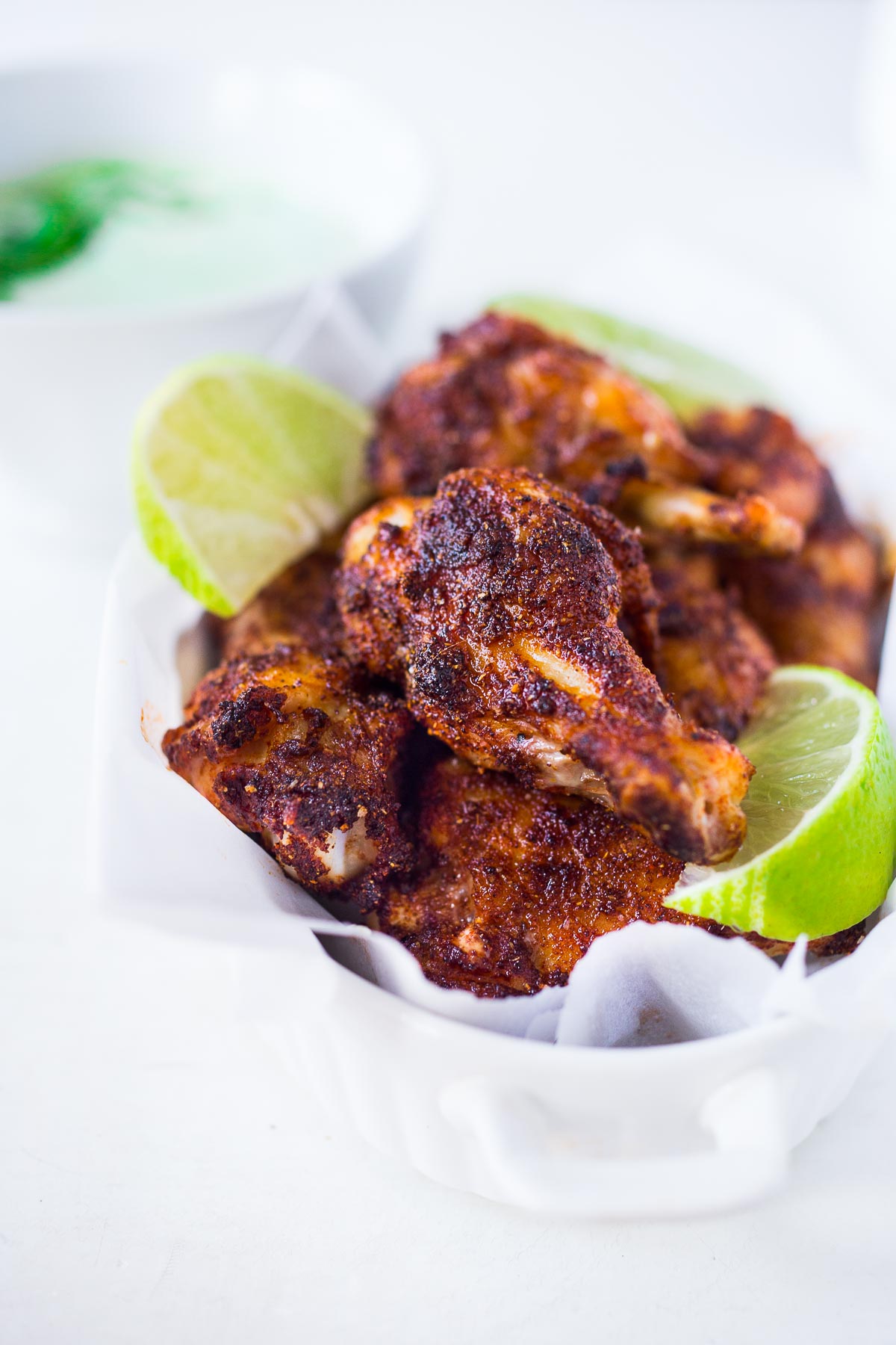 Baked Chicken Wings with a Smoky Chipotle Rub & Creamy Cilantro Dipping Sauce. A fast and healthy approach to chicken wings, packed full of deep smoky flavor! Easy and simple!