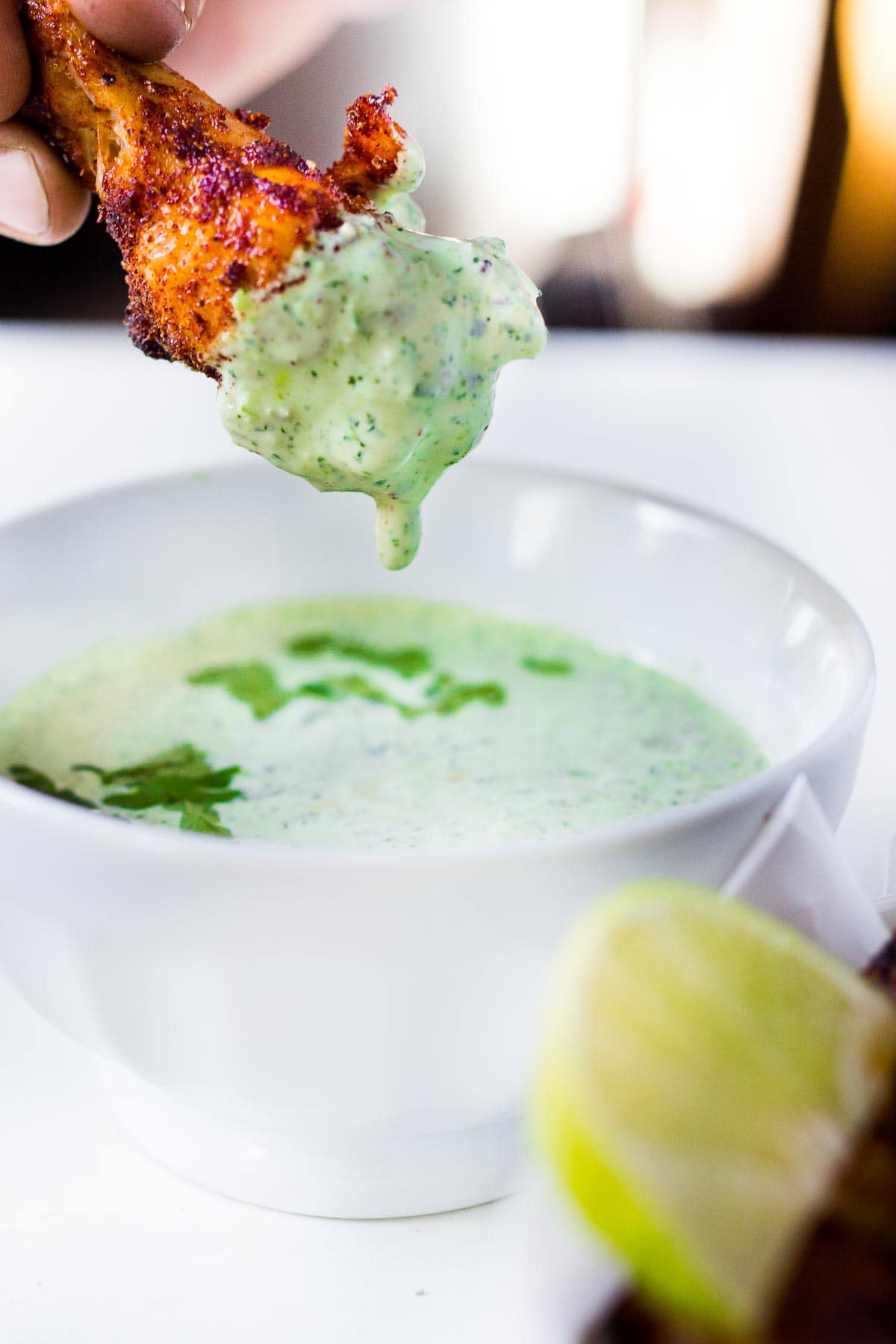 Baked Chicken Wings with a Smoky Chipotle Rub & Creamy Cilantro Dipping Sauce. A fast and healthy approach to chicken wings, packed full of deep smoky flavor! Easy and simple!