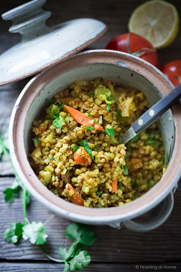 A healing bowl of khichdi, an Ayurvedic recipe considered to be India's "comfort food" made w/ healing ingredients, detoxing veggies & soothing turmeric. Vegan and GF | www.feastingathome.com #khichuri #khichdi #khichidi #ayurvedic #ayervedicrecipes #khichadi #vegan 