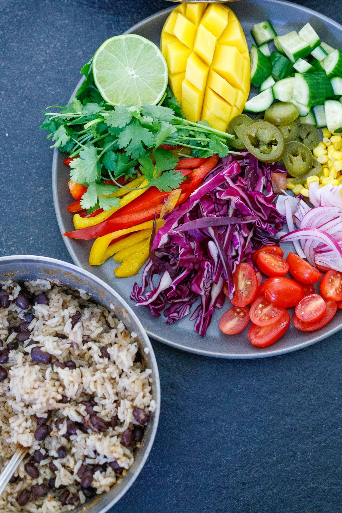 prepped platter of veggies for burrito bowls. 