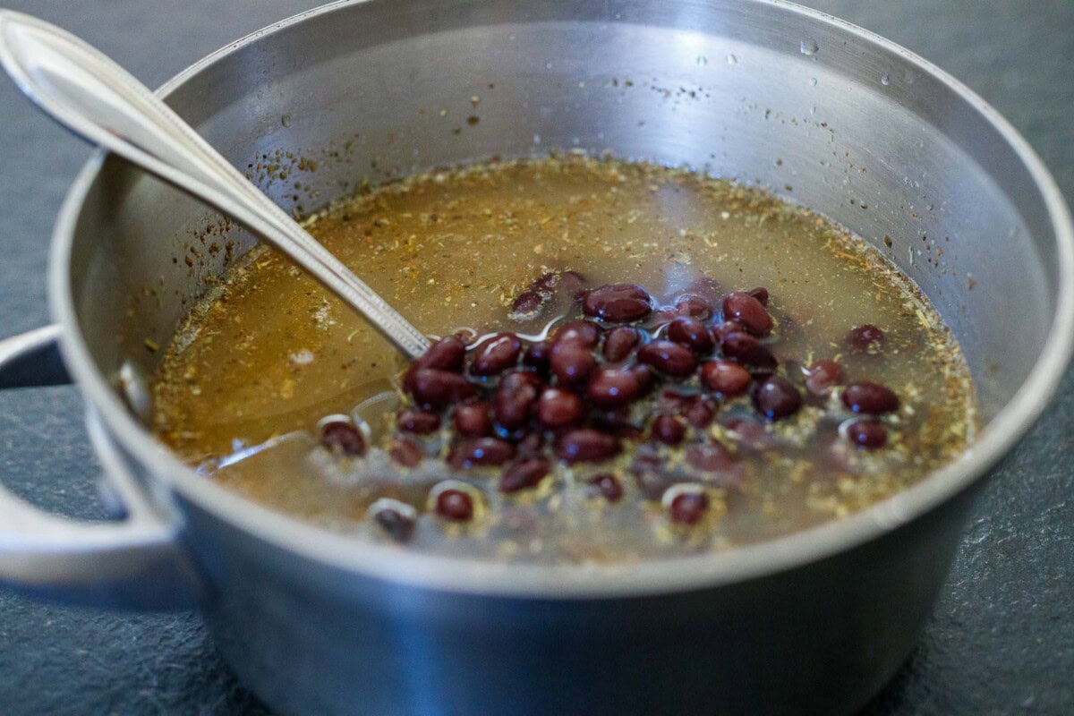 stirring rice and beans. 