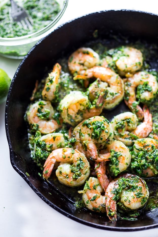 chimichurri shrimp in skillet, shrimp and sauce tossed together.