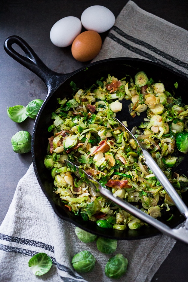 A delicious low-carb breakfast- Brussels sprouts and bacon hash topped with soft pillowy poached eggs. Bacon is optional. See recipe notes for alternatives! 