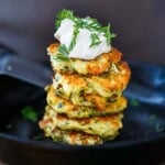 Greek-inspired zucchini fritters recipes with feta cheese and dill are light and crispy and packed with flavor! Meal prep a double batch!