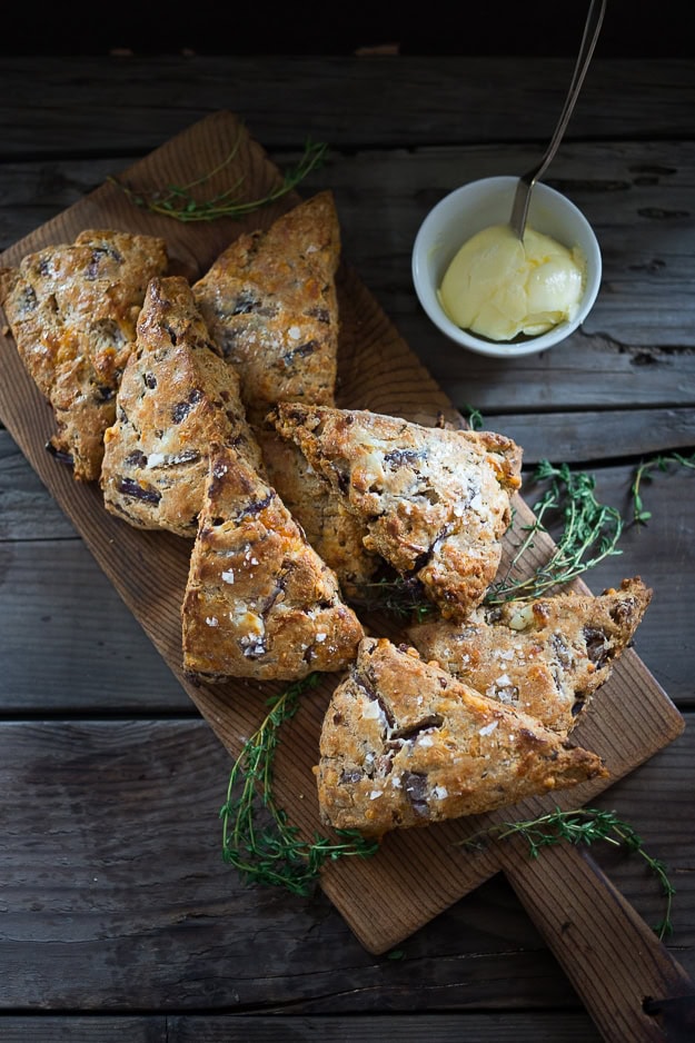 Cheddar scones on a cutting board.