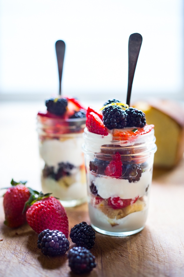 Summer Berry Trifle with whipped coconut cream, toasted coconut and lemon cake. A luxurious dessert that is simple to make. #trifle #berries #coconutcream #coconutwhippedcream 