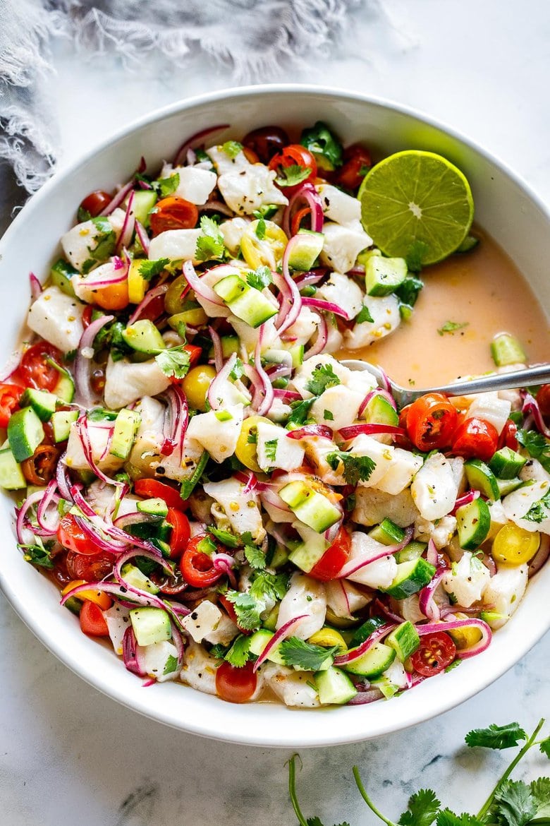 How to make the Best Ceviche! Ceviche is typically made with fresh fish (or shrimp) cured with lime juice, then tossed with onions, cilantro, tomato and cucumber.  Serve it as an appetizer with tortilla chips or as a light, refreshing summer meal.