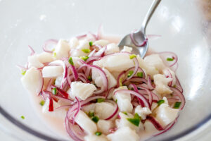 add the fish to the bowl with the onions