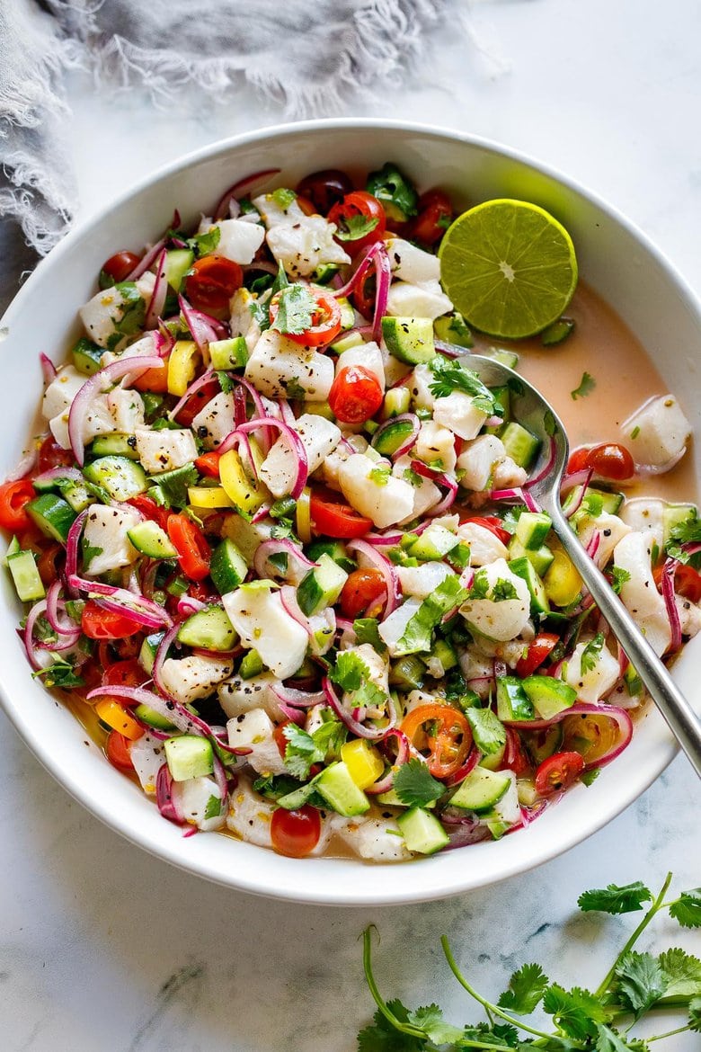 How to make the Best Ceviche! Ceviche is typically made with fresh fish (or shrimp) cured with lime juice, then tossed with onions, cilantro, tomato and cucumber.  Serve it as an appetizer with tortilla chips or as a light, refreshing summer meal.