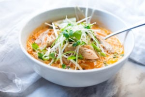 Laksa Soup w/ Malaysian style coconut curry broth, chicken or shrimp over rice noodles with fresh bean spouts, lime and cilantro. | www.feastingathome.com