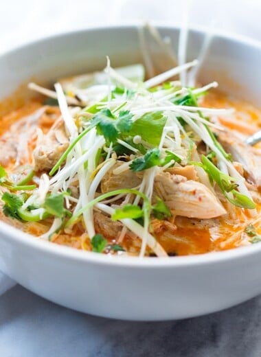 Laksa Soup w/ Malaysian style coconut curry broth, chicken or shrimp over rice noodles with fresh bean spouts, lime and cilantro. | www.feastingathome.com