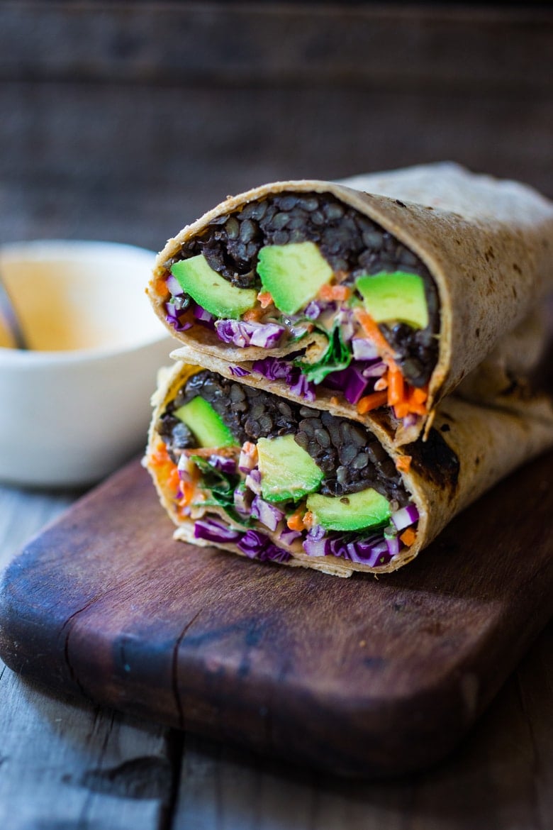 20 Delicious Healthy Lunches! |Spicy Lentil Wrap with Tahini Sauce - This easy vegan lentil wrap is full of crunchy raw veggies like carrots, beets, and cabbage with a spicy Sriracha Tahini sauce spooned over top. Simple, energiz