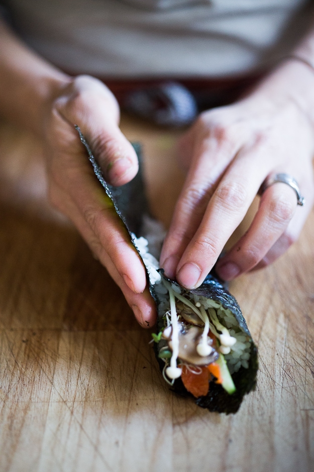 Healthy Smoked Salmon Hand rolls filled with avocado, cucumber and smoked salmon...an affordable fun way to feed a large gathering! | www.feastingathome.com