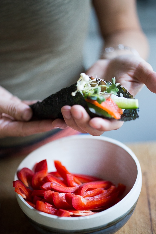 Smoked Salmon Hand Rolls filled with avocado, cucumber and smoked salmon with an easy step by step guide to making this Japanese-style sushi roll! | www.feastingathome.com #handrolls #sushi #salmon #smokedsalmon #salmonroll 