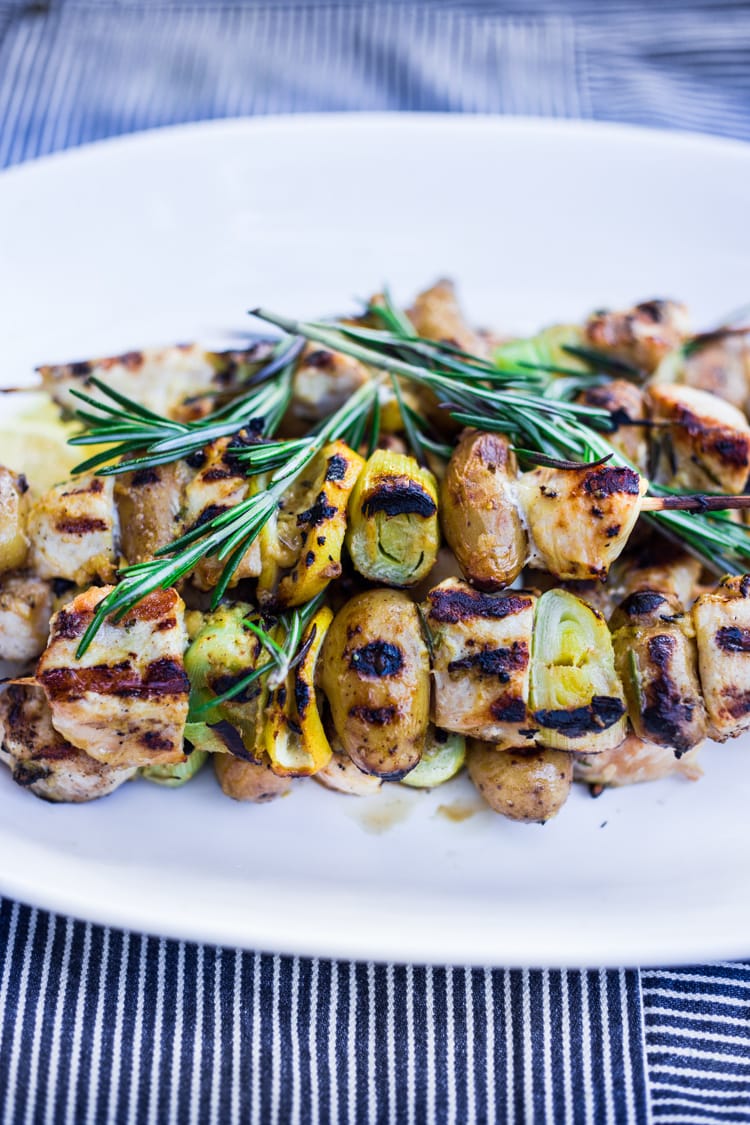 Grilled Dijon Chicken Skewers with leeks, potatoes and Rosemary. A delicious, healthy meal perfect for summer nights on the patio! #skewers #chickenskewers #dijonchicken #grilledchicken 