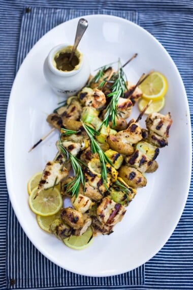 Grilled Dijon Chicken Skewers with leeks, potatoes and Rosemary. A delicious, healthy meal perfect for summer nights on the patio! #skewers #chickenskewers #dijonchicken #grilledchicken