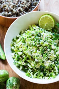 Vegan Mexican Brussel Sprout Salad with jalapeño, lime and cilantro! Serve as a "taco slaw",  a side salad for grill mains or meats, or over a bowl of quinoa, with avocado, black beans, cherry tomatoes, feta...or keep it lean and vegan! This salad can be made ahead! 