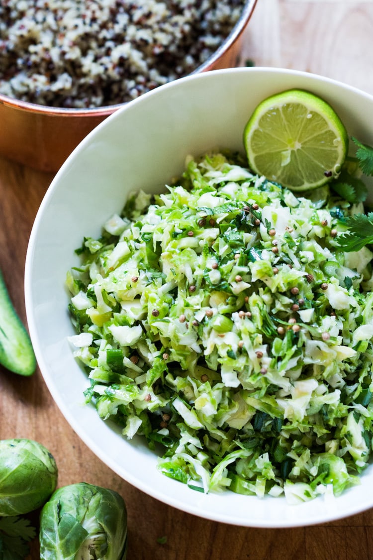 Vegan Mexican Brussel Sprout Salad with jalapeño, lime and cilantro! Serve as a "taco slaw",  a side salad for grill mains or meats. This salad can be made ahead! #brusselsproutsalad #brusslesproutslaw #brusselsprouts #veganslaw #vegansalad #mexicanslaw