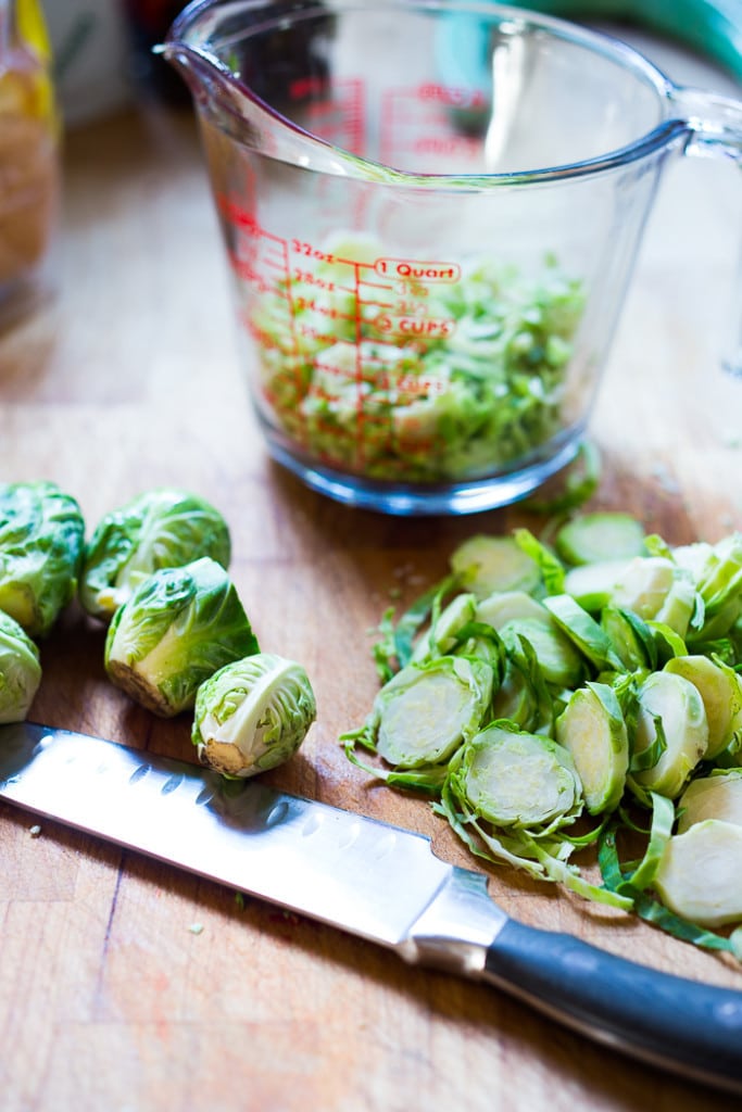 Vegan Mexican Brussel Sprout Salad with jalapeño, lime and cilantro! Serve as a "taco slaw",  a side salad for grill mains or meats. This salad can be made ahead! #brusselsproutsalad #brusslesproutslaw #brusselsprouts #veganslaw #vegansalad #mexicanslaw