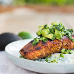 Grilled Salmon Salad with Avocado-Cucumber Salsa and over a bed of Little gems, with a Creamy Cilantro Lime Dressing.
