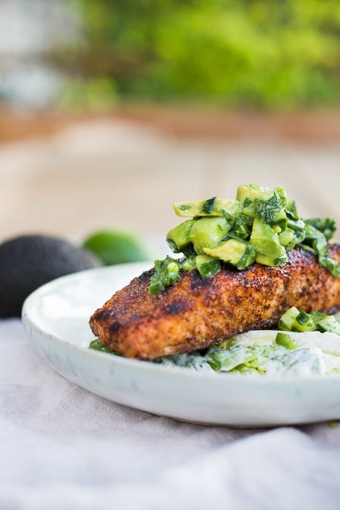 Grilled salmon topped with an avocado cucumber salsa. 