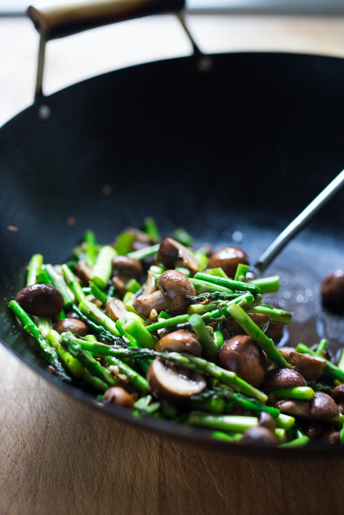 This simple flavorful Asparagus Mushroom Stir-Fry is loaded up with vibrant spring veggies in a simple sauce, with your choice of protein. It can be made in 20 minutes flat! Keep it vegan with crispy tofu, or add chicken or shrimp! 