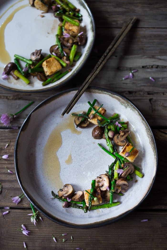 This simple flavorful Asparagus Mushroom Stir-Fry is loaded up with vibrant spring veggies in a simple sauce, with your choice of protein. It can be made in 20 minutes flat! Keep it vegan with crispy tofu, or add chicken or shrimp! 