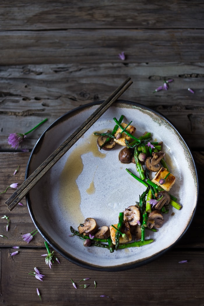This simple flavorful Asparagus Mushroom Stir-Fry is loaded up with vibrant spring veggies in a simple sauce, with your choice of protein. It can be made in 20 minutes flat! Keep it vegan with crispy tofu, or add chicken or shrimp! 