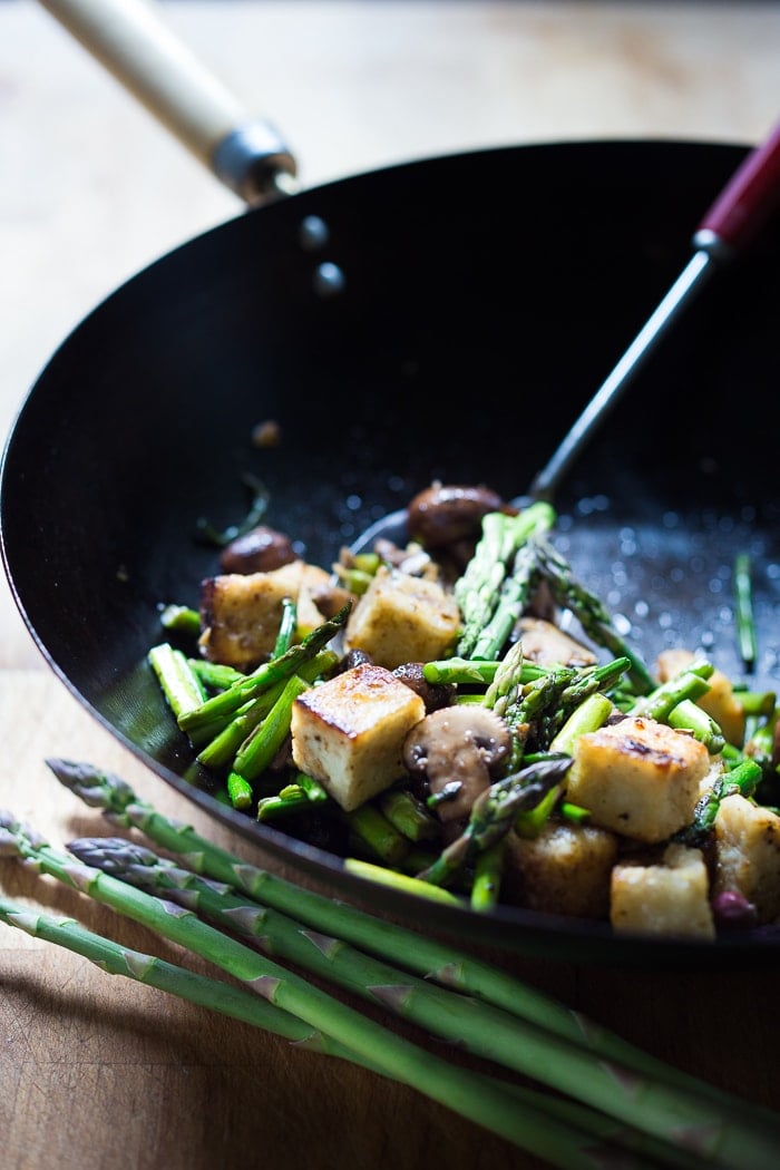 This simple flavorful Asparagus Mushroom Stir-Fry is loaded up with vibrant spring veggies in a simple sauce, with your choice of protein. It can be made in 20 minutes flat! Keep it vegan with crispy tofu, or add chicken or shrimp! 