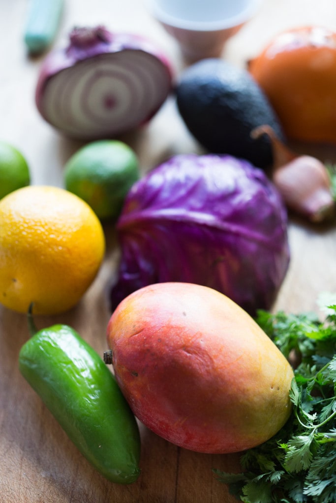 Caribbean Cabbage and Mango Slaw- this healthy, detoxing recipe is low in fat, vegan and gluten free. Makes a great side...or try this in my Caribbean Shrimp Tacos! | www.feastingathome.com