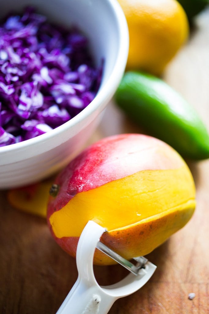 Caribbean Cabbage and Mango Slaw- this healthy, detoxing recipe is low in fat, vegan and gluten free. Makes a great side...or try this in my Caribbean Shrimp Tacos! | www.feastingathome.com