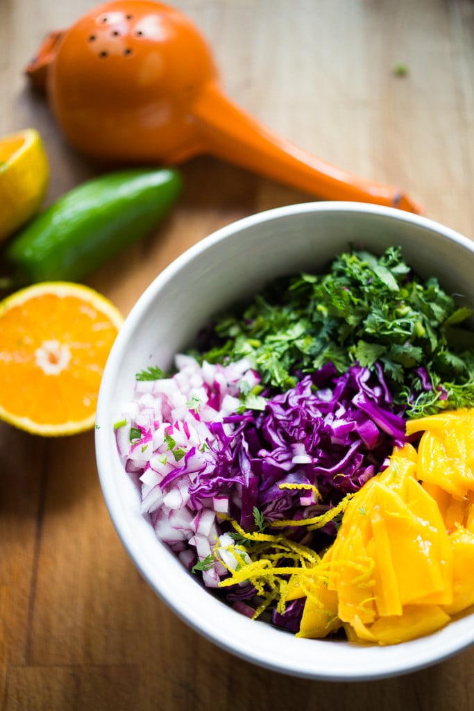 Caribbean Cabbage and Mango Slaw- this healthy, detoxing recipe is low in fat, vegan and gluten free. Makes a great side...or try this in my Caribbean Shrimp Tacos! | www.feastingathome.com