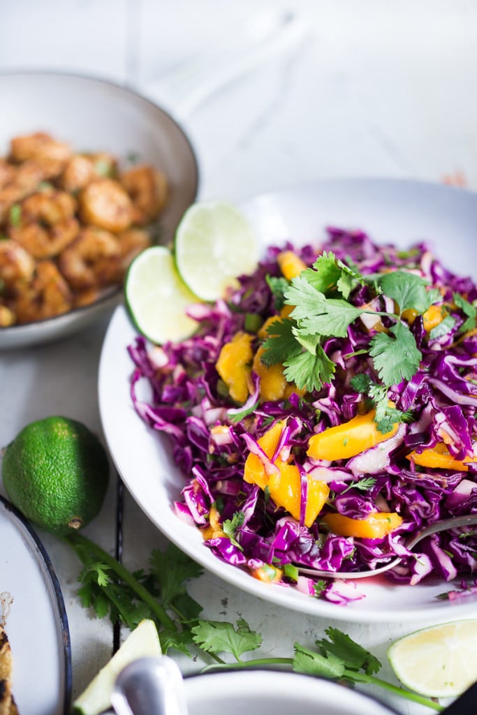 Caribbean Cabbage and Mango Slaw- this healthy, detoxing recipe is low in fat, vegan and gluten free. Makes a great side...or try this in my Caribbean Shrimp Tacos! | www.feastingathome.com