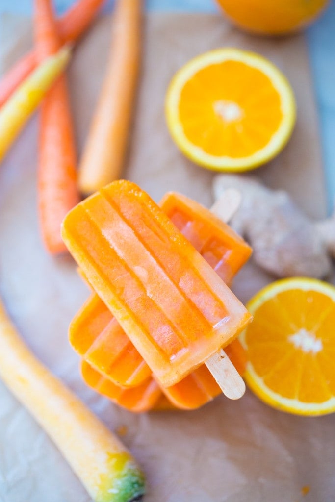 Healthy, delicious Popsicles with Orange, Carrot and Ginger and a hint of Turmeric, incredibly restorative and refreshing! | www.feastingathome.com