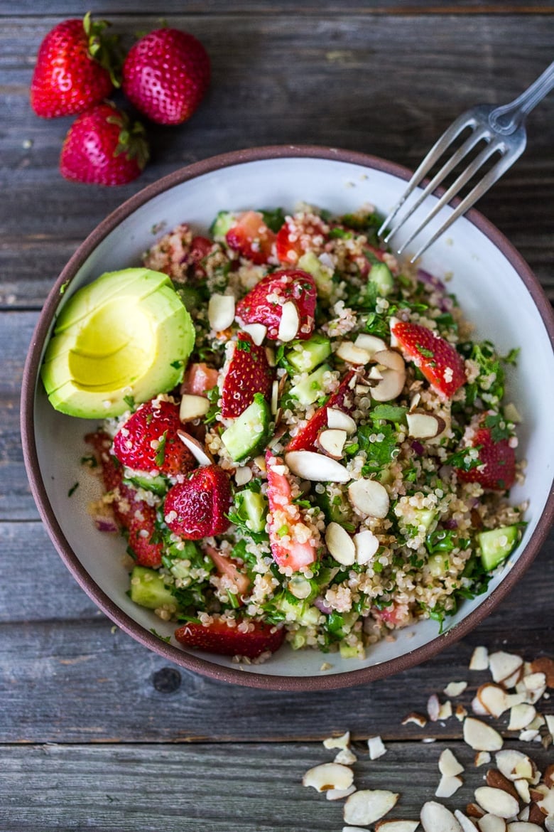 Delicious Strawberry Tabouli Salad - a twist on traditional tabouli, this spring-inspired version is made with quinoa, parsley, mint, and cucumber. Add avocado, toasted, slivered almonds, or feta if you like! #tabouli