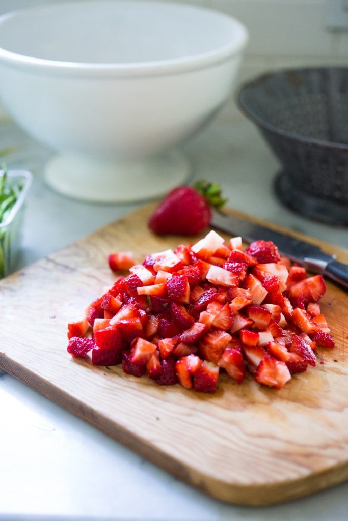 Strawberry Quinoa Tabouli, a refreshing summer salad that is vegan and gluten free and packed full of healthy ingredients! | www.feastingathome.com