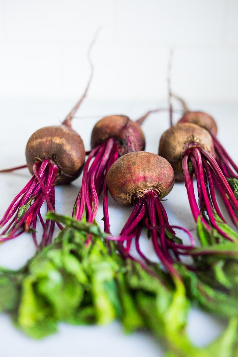 How to Make Beet Kvass! A sparkly Ukrainian probiotic drink made with beets, sea salt and water. Full of healthy probiotics from the Lacto-fermentation, Beet Kvass is believed to help boost immunity.  It tastes slightly sweet, tangy, earthy and salty- but in a good way! With just 10 minutes of hands-on time,it is so simple- just let mother nature take its course.  (Allow 2 weeks for fermentation- see notes for speeding up this process.)