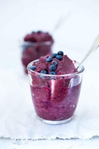 How to make a healthy, homemade Blueberry Slushie with just two ingredients. Naturally sweetened with no added sugar, it's a fast, healthy, refreshing treat, perfect for summer! 